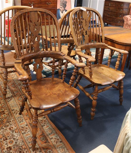 A set of four beech and elm Windsor stickback armchairs